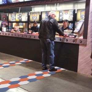 Man standing at the concessions generating energy