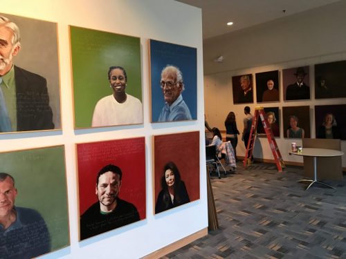 The 'Americans Who Tell The Truth' exhibit being setup by museum studies graduate students in the Panasci Lounge.